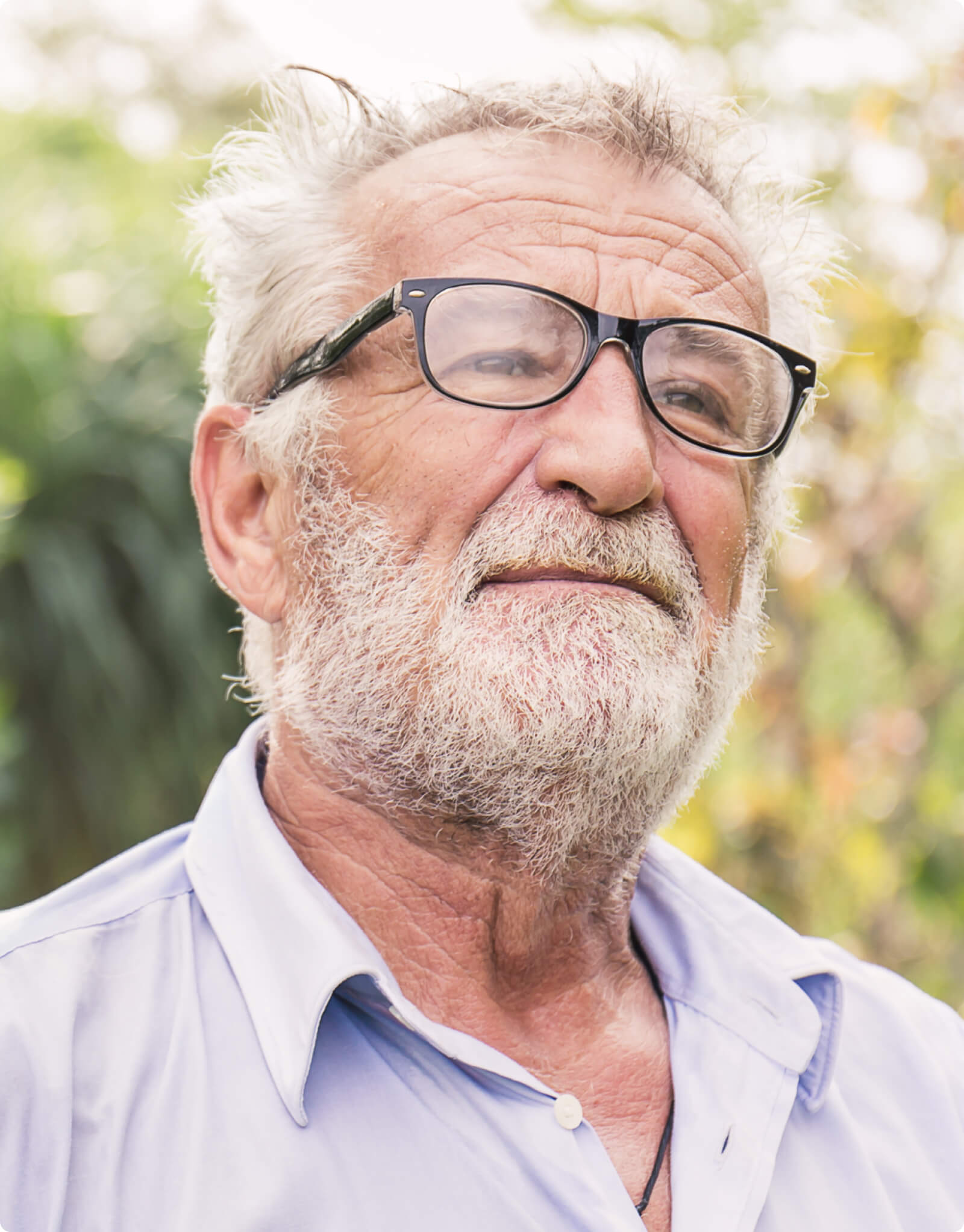 Older man standing outside