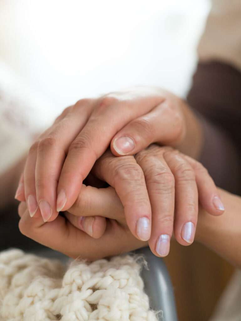 Two women holding hands