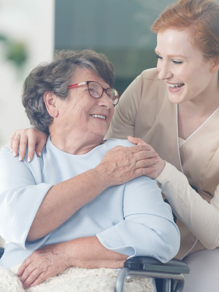 Medical volunteer smiling with her patient