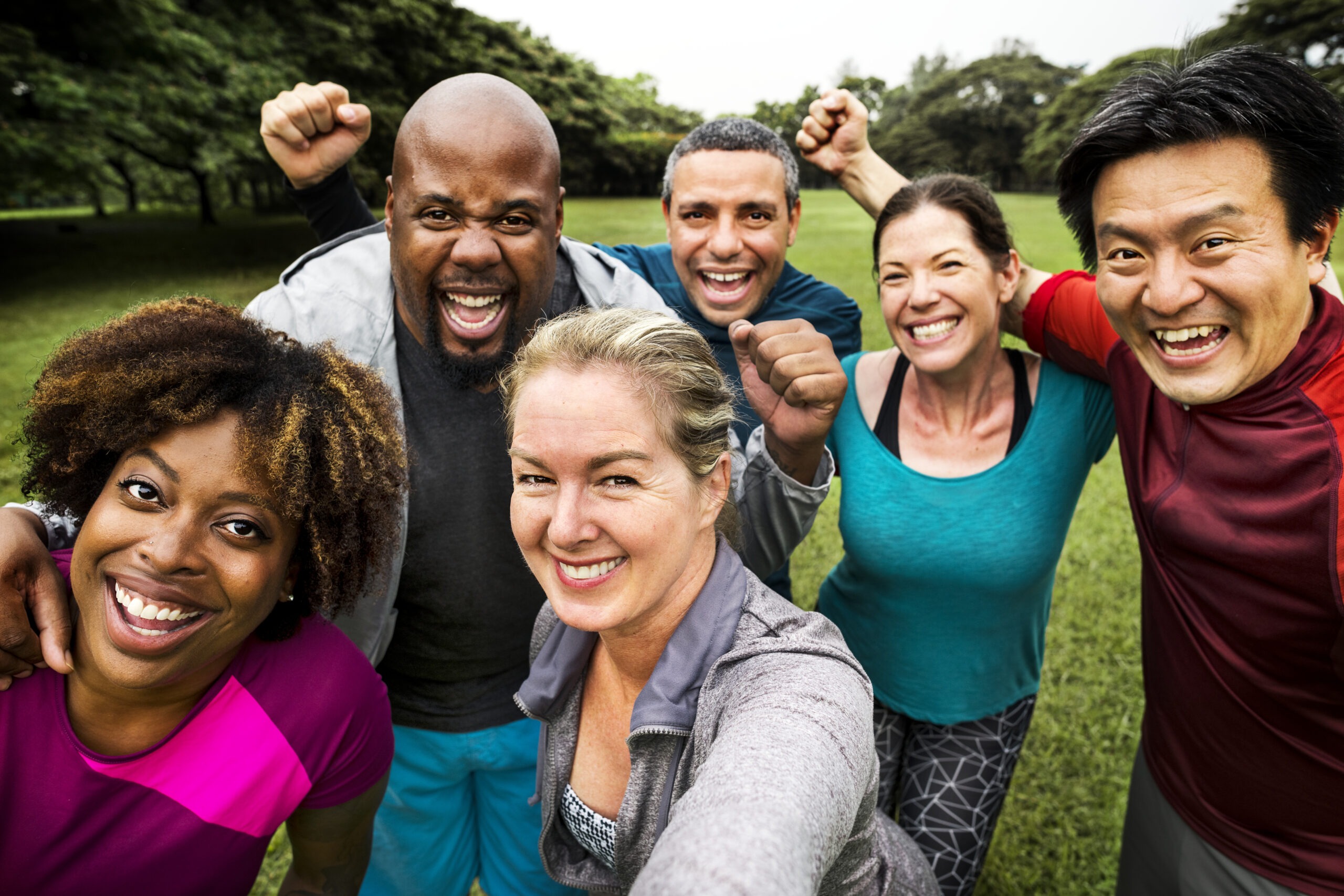 Group of cheerful diverse friends in the park