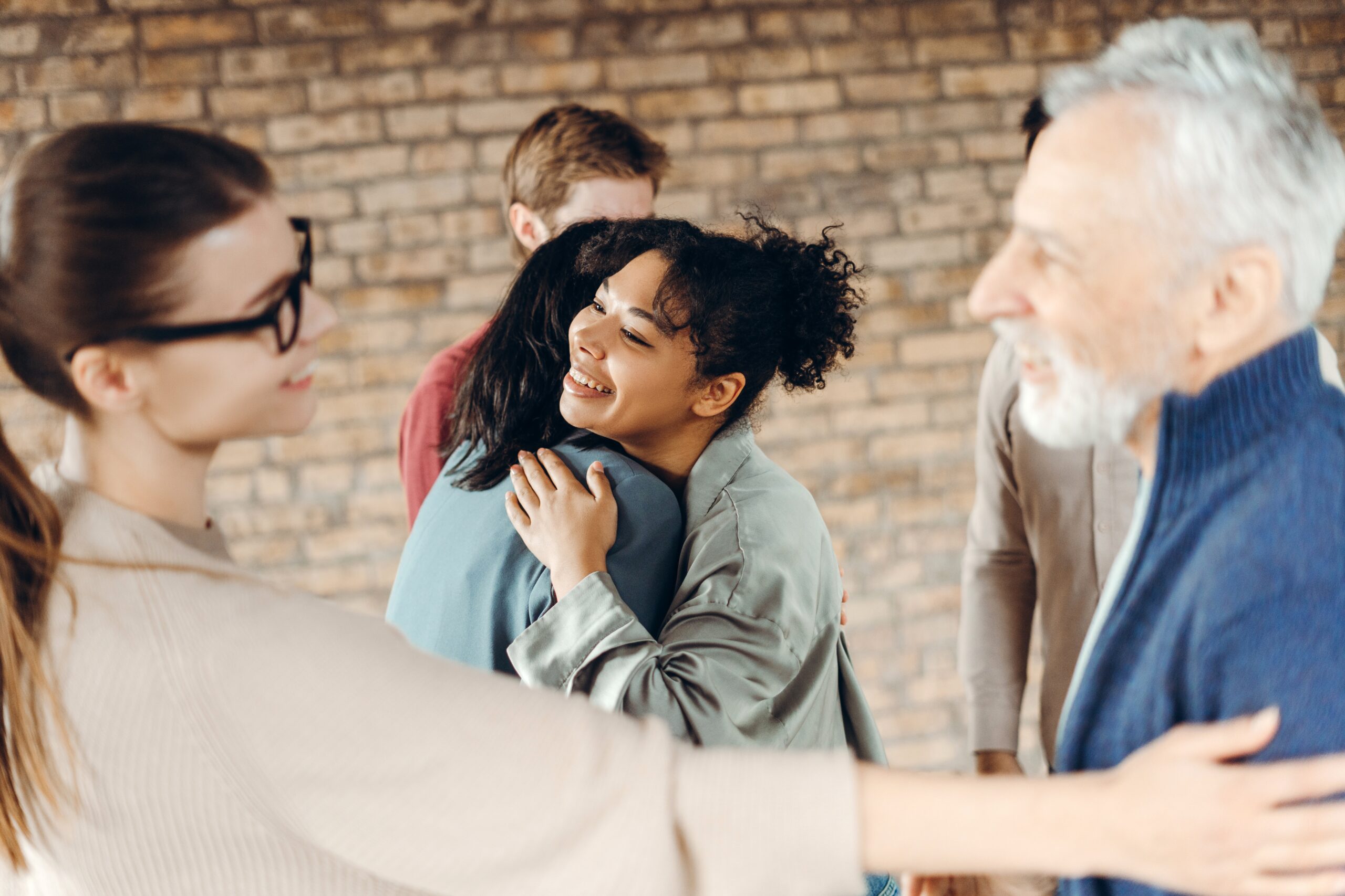 Person comforting, hugging others